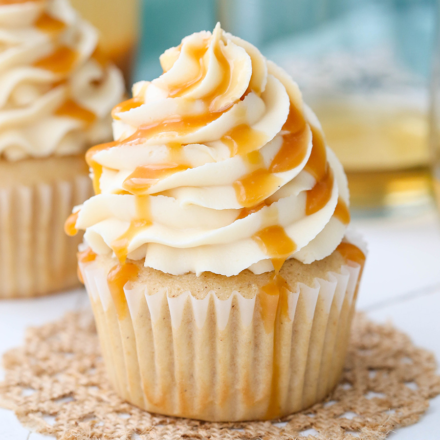 Image of a vanilla cupcake with caramel drizzle