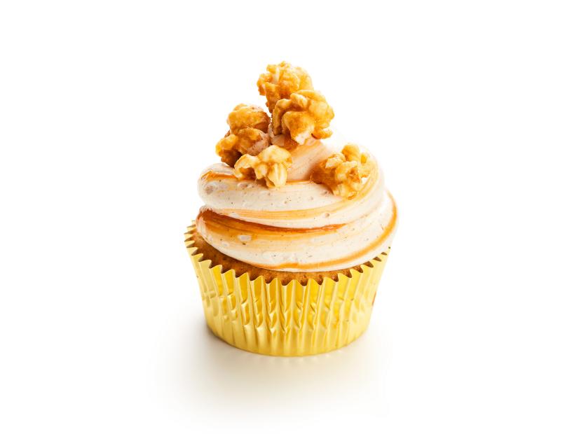 Image of a vanilla cupcake topped with caramel popcorn
